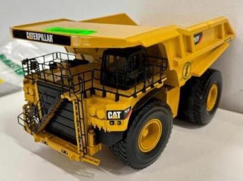 DESCRIPTION: MINI METAL CAT DUMPTRUCK INFORMATION: ONE WHEEL NEEDS TO BE RESECURED LOCATION: MAIN FLOOR QTY: 1