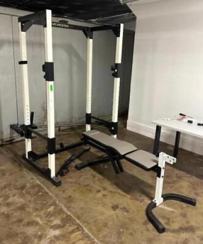 DESCRIPTION: WORKOUT BENCH WITH RACK AND PULLY WEIGHT ATTACHMENT BRAND/MODEL: CLUB WEIDER 565 LOCATION: BOTTOM FLOOR QTY: 1