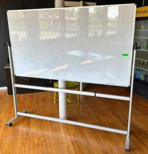 DESCRIPTION: DRY ERASE BOARD ON CASTERS SIZE: 70"X40" LOCATION: 2ND FLOOR QTY: 1