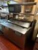 DESCRIPTION TRUE 48" REFRIGERATED SANDWICH PREP TOP COOLER W/ TWO TIER STAINLESS RISER SHELF. BRAND / MODEL: TRUE TSSU-48-18M-B ADDITIONAL INFORMATION