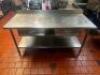 DESCRIPTION 72" X 30" ALL STAINLESS TABLE W/ 4" BACK SPLASH SIZE 72" X 30" LOCATION KITCHEN QTY 1