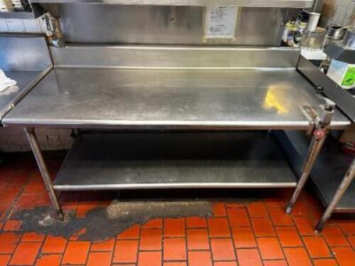 DESCRIPTION 72" X 30" STAINLESS TABLE W/ 6" BACK SPLASH AND MOUNTED CAN OPENER. ADDITIONAL INFORMATION HEAVY DUTY SIZE 72" X 30" LOCATION KITCHEN QTY