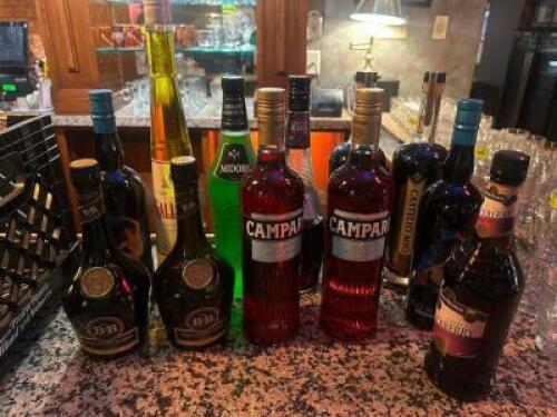 DESCRIPTION MILK CRATE AND CONTENTS - ASSORTED PARTIAL BOTTLES OF ALCOHOL. ADDITIONAL INFORMATION SEE PICTURE FOR ITEMS IN LOT. LOCATION BAR QTY 1