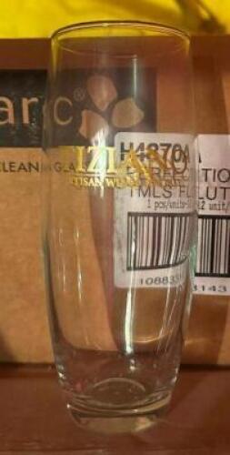 DESCRIPTION (60) 9 OZ LOGO'ED FLUTE GLASSES ( 5 CASES ) THIS LOT IS: SOLD BY THE PIECE LOCATION BASEMENT 1 QTY 5