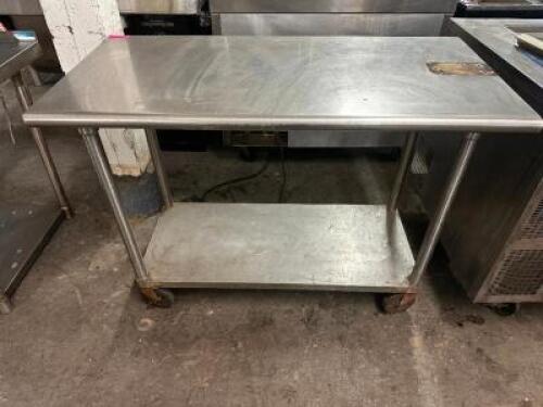 50" X 24" STAINLESS TABLE ON CASTERS.
