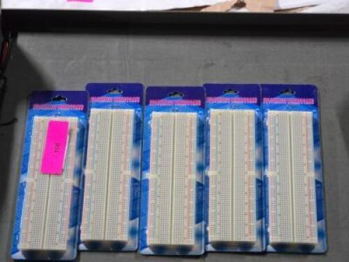 DESCRIPTION: (5) SOLDERLESS BREADBOARDS BRAND/MODEL: ADAFRUIT 64 SIZE: 3.40" L 2.20" W QTY: 5