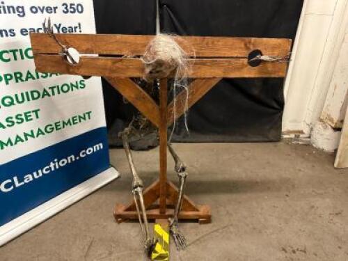WOODEN STOCK PROP W/ SKELETON.