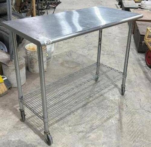 STAINLESS TABLE WITH WIRE UNDERSHELF ON CASTERS