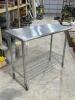 STAINLESS TABLE WITH WIRE UNDERSHELF ON CASTERS - 2