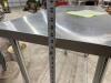 STAINLESS TABLE WITH WIRE UNDERSHELF ON CASTERS - 8