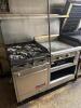 FRANKLIN CHEF FOUR BURNER RANGE W/ 24" GRIDDLE.