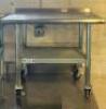 36 "X 24" STAINLESS TABLE W/ 2" BACK SPLASH.
