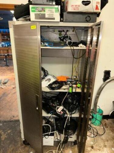 TWO DOOR METAL STORAGE CABINET W/ CONTENTS - ASSORTED CABLE AND ROUTER BOXES.