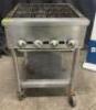 DESCRIPTION 24" FOUR BURNER RADIANT CHARBROILER. ADDITIONAL INFORMATION NATURAL GAS, ON CASTERS SIZE 24" LOCATION BAY 6 QTY 1