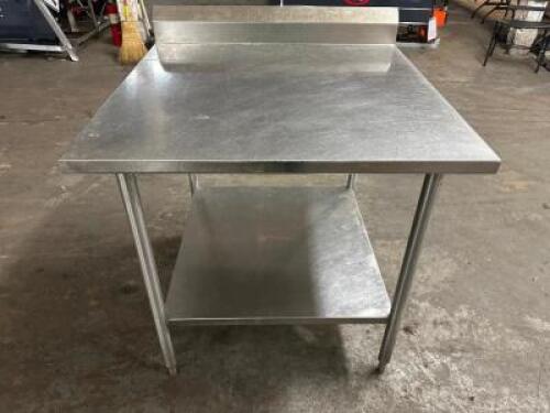 DESCRIPTION 36" X 30" STAINLESS TABLE W/ 4" BACK SPLASH SIZE 36" X 30" LOCATION BAY 6 QTY 1