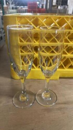 DESCRIPTION (25) CHAMPAGNE GLASSES ADDITIONAL INFORMATION W/ GLASS RACK THIS LOT IS: SOLD BY THE PIECE LOCATION BAY 6 QTY 25