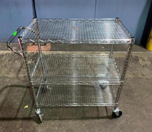 DESCRIPTION: METAL THREE TIER CART ADDITIONAL INFORMATION: TWO WHEELS ARE BENT SIZE: 18"X30"X33" LOCATION: LEVEL 2 QTY: 1