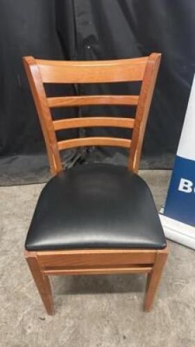 (4) LADDER BACK TAN WOOD CHAIRS W/ BLACK SEAT CUSHIONS