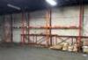 (7) - SECTIONS OF 12' TEAR DROP PALLET RACKING WITH WOOD DECKING