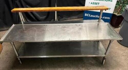 DESCRIPTION 72" X 36" LOW BOY STAINLESS EQUIPMENT STAND W/ CUTTING BOARD RISER. ADDITIONAL INFORMATION ON CASTERS. ROLLS WELL. CONTENTS ARE NOT INCLUD