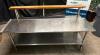 DESCRIPTION 72" X 36" LOW BOY STAINLESS EQUIPMENT STAND W/ CUTTING BOARD RISER. ADDITIONAL INFORMATION ON CASTERS. ROLLS WELL. CONTENTS ARE NOT INCLUD