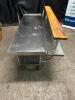 DESCRIPTION 72" X 36" LOW BOY STAINLESS EQUIPMENT STAND W/ CUTTING BOARD RISER. ADDITIONAL INFORMATION ON CASTERS. ROLLS WELL. CONTENTS ARE NOT INCLUD - 5