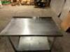 DESCRIPTION 48" X 30" STAINLESS TABLE W/ UNDER SHELF AND 1" BACK SPLASH. ADDITIONAL INFORMATION CONTENTS ARE NOT INCLUDED. SIZE 48" X 30" LOCATION BAY - 2