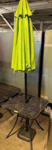 DESCRIPTION 27" X 27" METAL PATIO TABLE W/ UMBRELLA AND STAND. ADDITIONAL INFORMATION NO CHAIRS W/ THIS LOT. SIZE 27" X 27" LOCATION BAY 6 QTY 1