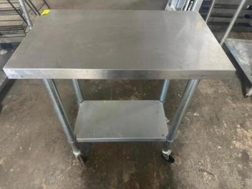 DESCRIPTION 30" X 18" STAINLESS TABLE ON CASTERS. ADDITIONAL INFORMATION W/ GALV UNDER SHELF. SIZE 30" X 18" LOCATION BAY 6 QTY 1