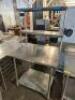 DESCRIPTION 36" X 30" STAINLESS TABLE W/ TWO TIER RISER SHELF. SIZE 36" X 30" LOCATION BAY 6 QTY 1 - 2