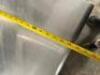 DESCRIPTION 36" X 30" STAINLESS TABLE W/ TWO TIER RISER SHELF. SIZE 36" X 30" LOCATION BAY 6 QTY 1 - 4