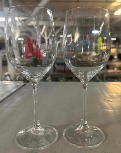 DESCRIPTION (25) WINE GLASSES. ADDITIONAL INFORMATION W/ GLASS RACK THIS LOT IS: SOLD BY THE PIECE LOCATION BAY 6 QTY 25