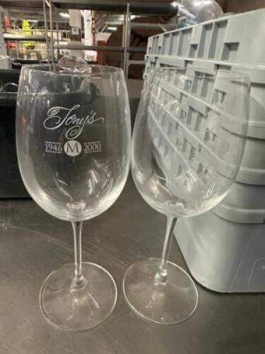 DESCRIPTION (25) WINE GLASSES. BRAND / MODEL: TONYS LOGO ADDITIONAL INFORMATION W/ GLASS RACK THIS LOT IS: SOLD BY THE PIECE LOCATION BAY 6 QTY 5