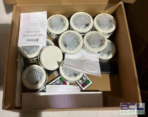BOX OF UNDERCOUNTER PUCK LIGHTS WITH REMOTES