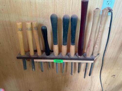 (11) ASSORTED LATHE TOOLS W/ WALL MOUNTED HOLDER.