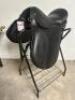 DESCRIPTION 17" BLACK LEATHER DRESSAGE SADDLE WITH BRIDAL, CINCH, AND STIRRUPS. BRAND / MODEL: JD IMPORTS ES001 ADDITIONAL INFORMATION NEW IN THE BOX.
