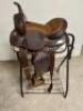 DESCRIPTION 13" BROWN AND SILVER LEATHER WESTERN SADDLE. COMES W/ BRIDAL, CINCH, STIRRUPS, AND SADDLE PAD. ADDITIONAL INFORMATION NEW IN THE BOX. SIZE