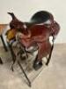DESCRIPTION 13" BROWN AND SILVER LEATHER WESTERN SADDLE. COMES W/ BRIDAL, CINCH, STIRRUPS, AND SADDLE PAD. ADDITIONAL INFORMATION NEW IN THE BOX. SIZE - 2
