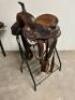 DESCRIPTION 13" BROWN AND SILVER LEATHER WESTERN SADDLE. COMES W/ BRIDAL, CINCH, STIRRUPS, AND SADDLE PAD. ADDITIONAL INFORMATION NEW IN THE BOX. SIZE - 3