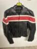 DESCRIPTION BLACK LEATHER RIDING JACKET W/ RED AND WHITE STRIP. ADDITIONAL INFORMATION NEW W/ PACKAGING SIZE LARGE LOCATION BAY 6 QTY 1