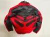 DESCRIPTION BLACK AND RED LEATHER RIDING JACKET. BRAND / MODEL: JD IMPORTS J206018 ADDITIONAL INFORMATION NEW W/ PACKAGING SIZE LARGE LOCATION BAY 6 Q - 2