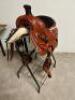 DESCRIPTION 13" WESTERN STYLE LEATHER SADDLE IN CHUNNEL. COMES W/ STIRRUPS. BRAND / MODEL: JD IMPORTS AS2401 ADDITIONAL INFORMATION NEW IN THE BOX. SI - 2
