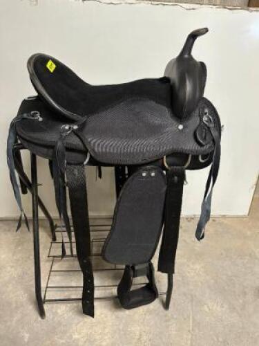 DESCRIPTION 15" WESTER STYLE SYNTHETIC SADDLE W/ STIRRUPS, AND CINCH. BRAND / MODEL: KRISHNA KS2203 ADDITIONAL INFORMATION NO BOX. SIZE 15" LOCATION B
