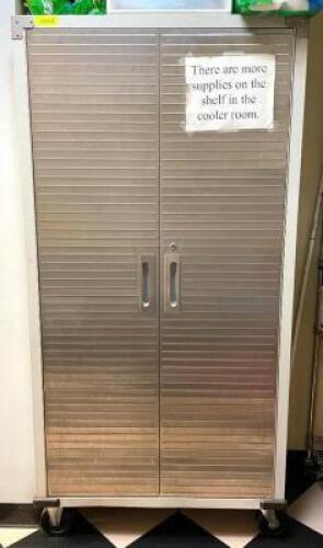 36" X 70" TWO DOOR METAL STORAGE CABINET ON CASTERS.