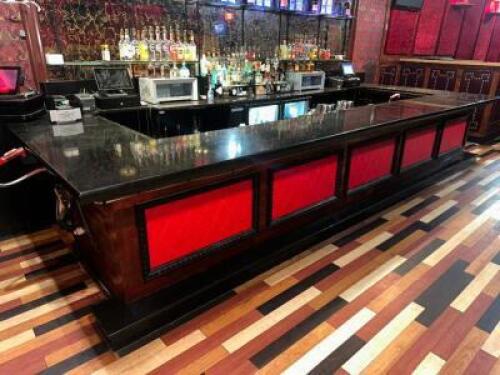 DESCRIPTION 20.5' X 8' " U SHAPED " BLACK STONE BAR TOP WITH WOODEN PANEL FRONT AND BAR RAIL. ADDITIONAL INFORMATION BAR TOP COMES IN 6' TO 8' SECTION