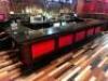 DESCRIPTION 20.5' X 8' " U SHAPED " BLACK STONE BAR TOP WITH WOODEN PANEL FRONT AND BAR RAIL. ADDITIONAL INFORMATION BAR TOP COMES IN 6' TO 8' SECTION