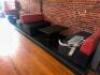 DESCRIPTION (2) SECTION 42" UPHOLSTERED BENCH / BOOTH SEATING W/ (2) 42" X 30" COMPOSITE BLACK TABLE'S ADDITIONAL INFORMATION (4) END CAP SECTIONS. RE