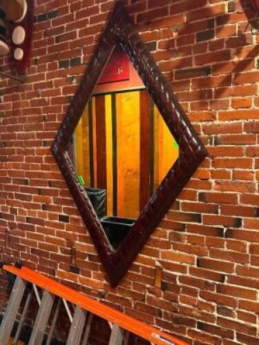 DESCRIPTION 78" X 48" ART DECO STYLE DIAMOND SHAPED MIRROR W/ VINYL PADDED FRAME. SIZE 78" X 48" LOCATION FIRST FLOOR HALL QTY 1
