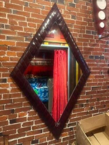 DESCRIPTION 78" X 48" ART DECO STYLE DIAMOND SHAPED MIRROR W/ VINYL PADDED FRAME. SIZE 78" X 48" LOCATION FIRST FLOOR HALL QTY 1