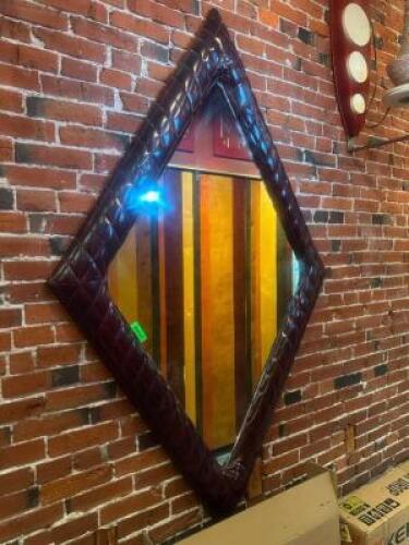 DESCRIPTION 78" X 48" ART DECO STYLE DIAMOND SHAPED MIRROR W/ VINYL PADDED FRAME. SIZE 78" X 48" LOCATION FIRST FLOOR HALL QTY 1